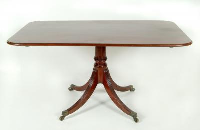 Appraisal: A MAHOGANY BREAKFAST TABLE of rounded oblong form moulded edged