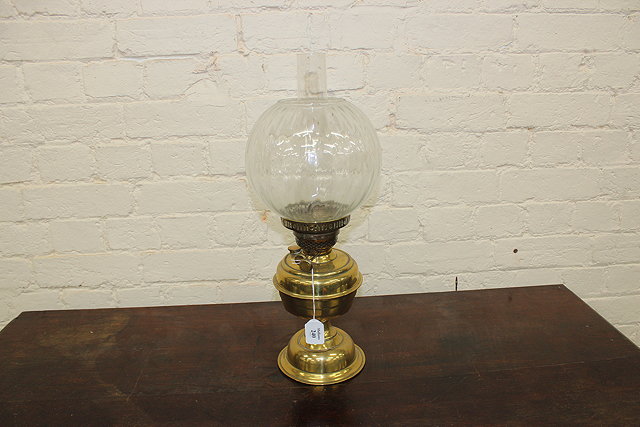 Appraisal: A BRASS OIL LAMP of baluster form with globe and