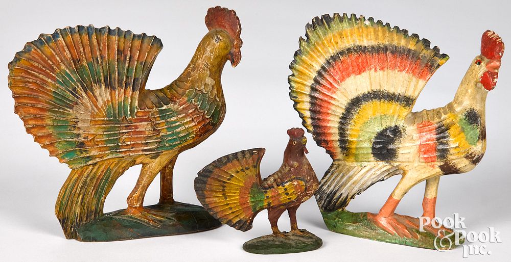 Appraisal: Three carved and painted roosters late th c Three carved