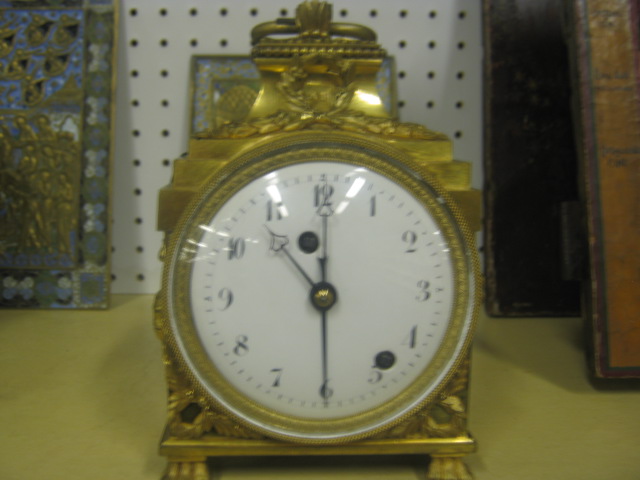 Appraisal: A French ormolu pendule d'officer mantel clock with four inch