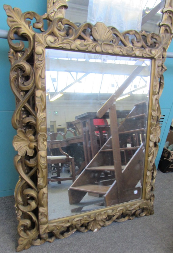 Appraisal: A th century gilt framed rectanguar wall mirror with shell