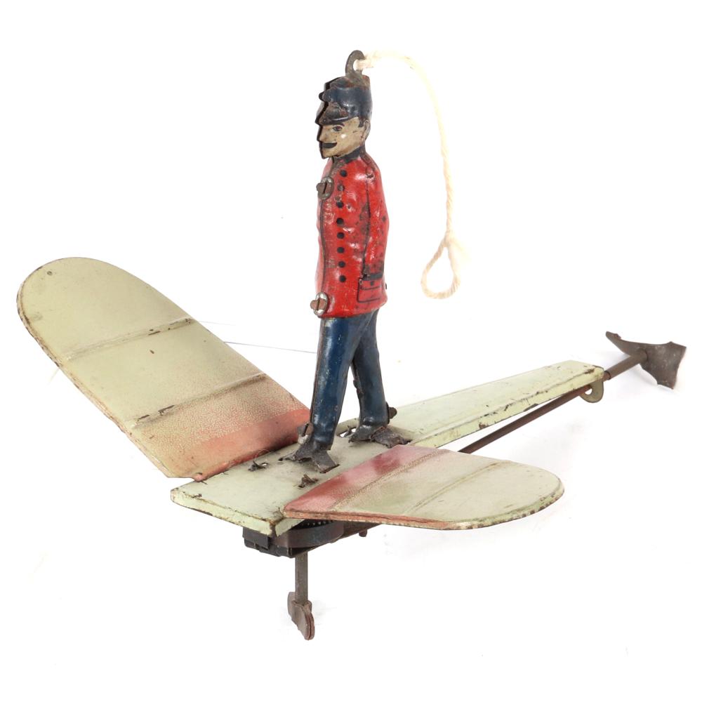 Appraisal: EARLY GERMAN TIN WINDUP CLOCKWORK FLYING AIRPLANE TOY WITH STANDING