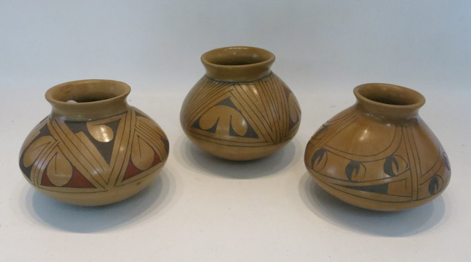 Appraisal: THREE MEXICAN POTTERY VESSELS having black and red geometric slip