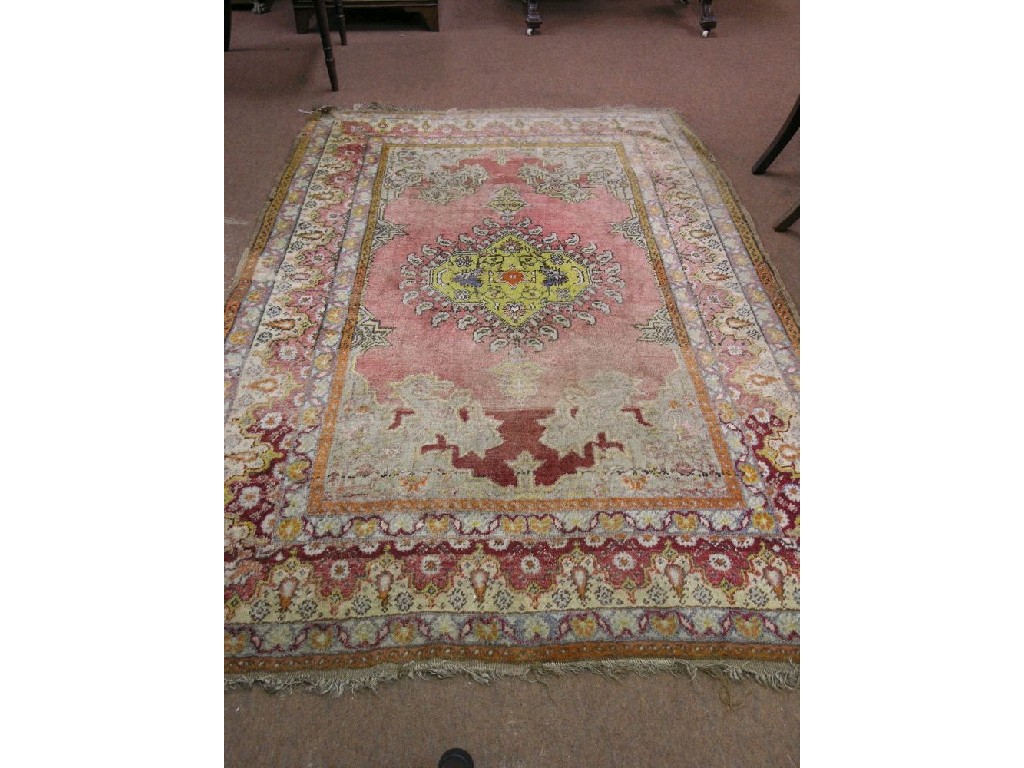 Appraisal: An Eastern wool rug bright patterns against a red field