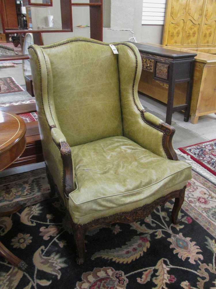 Appraisal: LOUIS XV STYLE WINGBACK LEATHER ARMCHAIR American early th century