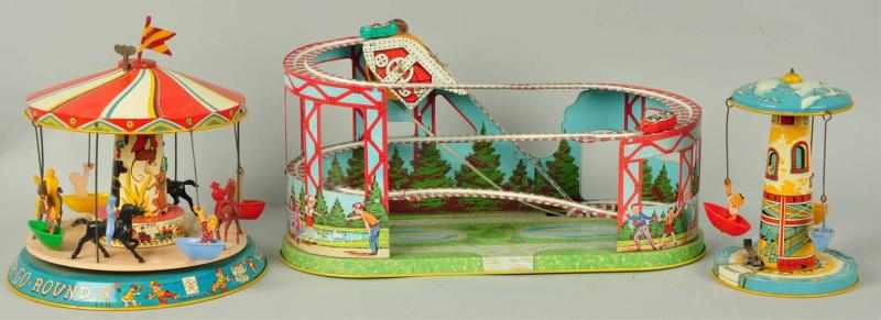 Appraisal: Tin Chein Unique Art Amusement Ride Toys Description American Includes