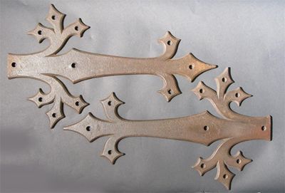 Appraisal: A set of three Gothic Reform cast iron hinge plates