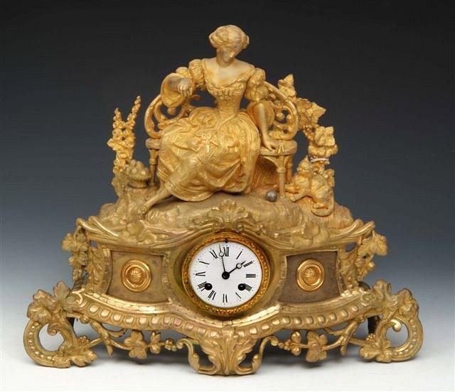 Appraisal: A FRENCH ORMOLU MANTEL CLOCK having a circular white enamel