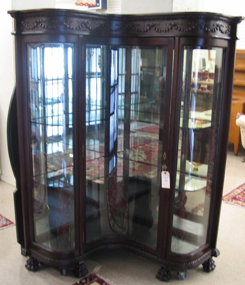 Appraisal: AN ANTIQUE OAK AND GLASS CORNER CHINA CABINET American c