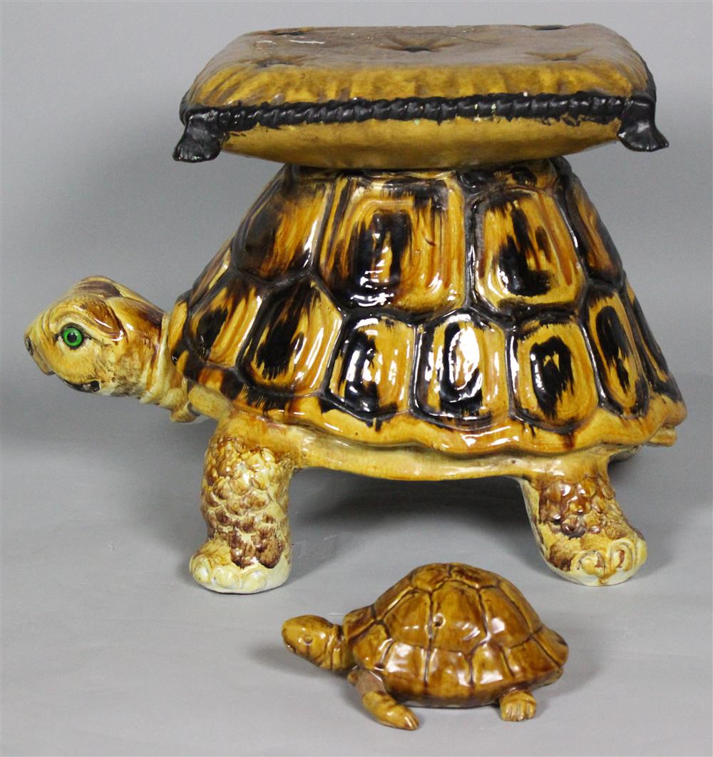 Appraisal: TWO AMBER YELLOW PAINTED POTTERY TORTOISES One large together with