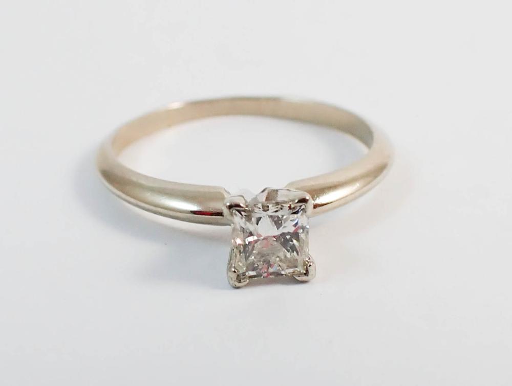 Appraisal: DIAMOND AND FOURTEEN KARAT WHITE GOLD SOLITAIRE RING with four