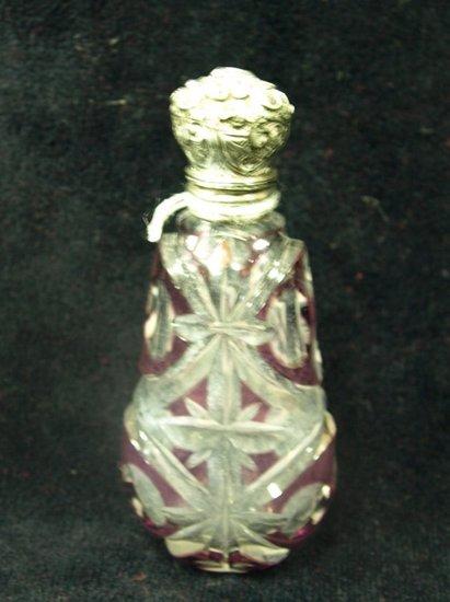 Appraisal: A Victorian cut glass clear and amethyst scent bottle with