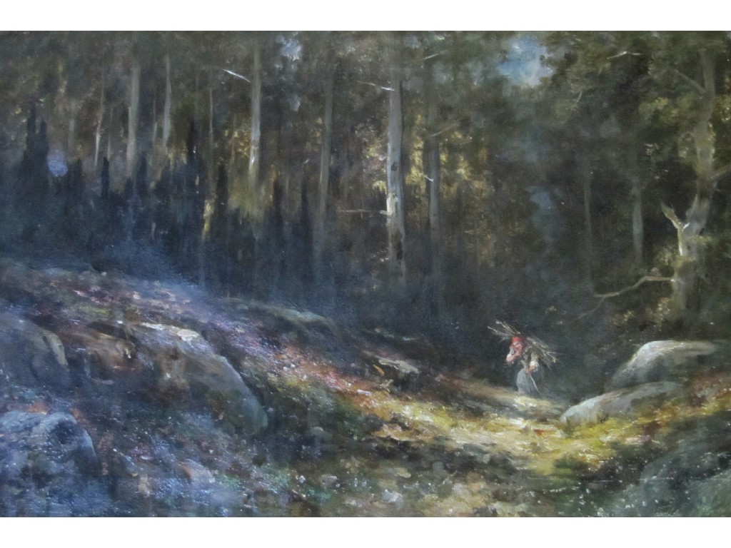 Appraisal: Oil on canvas woodland scene with a figure gathering faggots