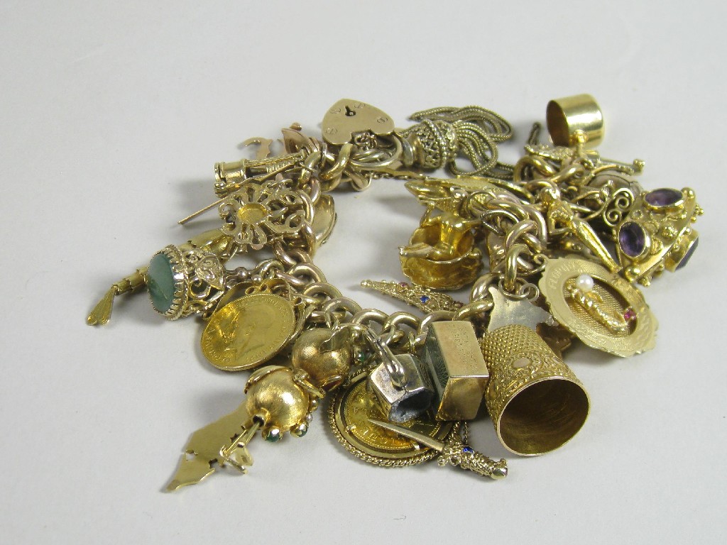 Appraisal: A ct gold Charm Bracelet with padlock fastener with numerous