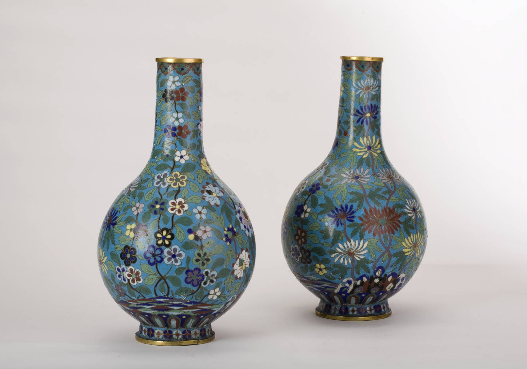 Appraisal: PAIR OF CHINESE CLOISONNE BOTTLE-FORM VASES WITH BLUE GROUND AND