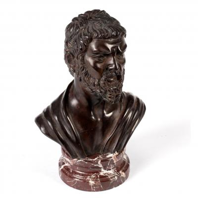 Appraisal: A bronze bust of a bearded man on a veined