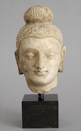 Appraisal: GHANDHARAN STUCCO BUDDHA HEAD With serene expression the curled hair