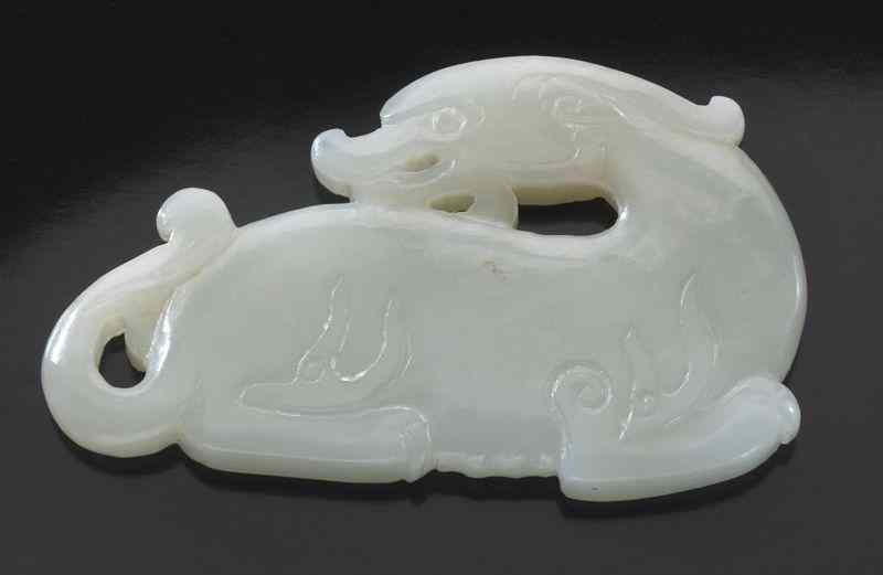 Appraisal: Chinese Qing carved white jade unicornseated on its hind legs