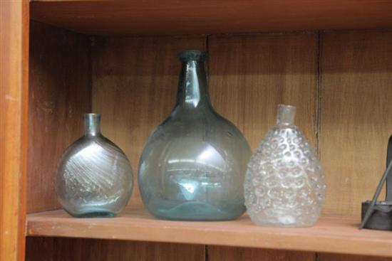 Appraisal: THREE BLOWN GLASS BOTTLES TWO AQUA AND ONE CLEAR Including