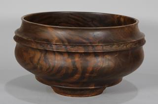 Appraisal: California chip-carved black walnut centerbowl having a tapered highly figured