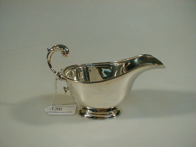 Appraisal: A George VI silver sauce boat with scroll handle and