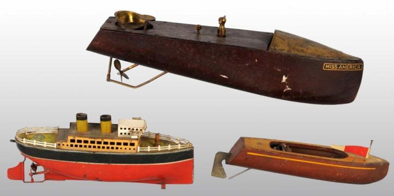 Appraisal: Lot of Battery- Operated Clockwork Toy Boats Description Includes wooden