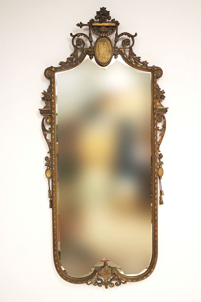 Appraisal: Vertical Continental Mirror Center top plaque Darkened gilt finish Side