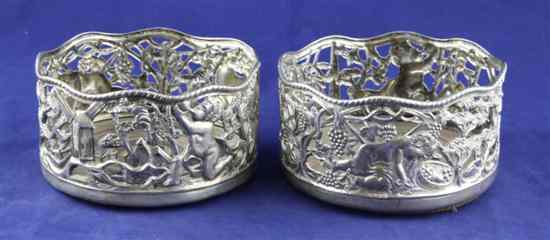 Appraisal: A pair of Edwardian Irish silver wine coasters pierced and