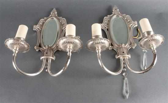 Appraisal: Pair of Neoclassical style silver-plated two-light mirrored back sconces Estimate