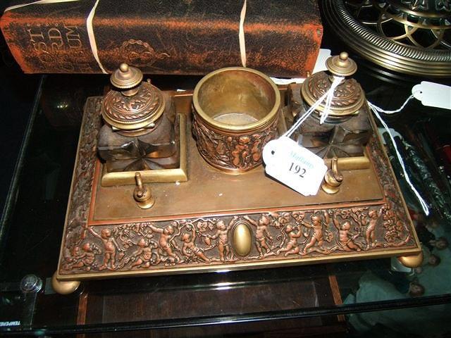 Appraisal: A Victorian copper and brass desk stand fitted with twin