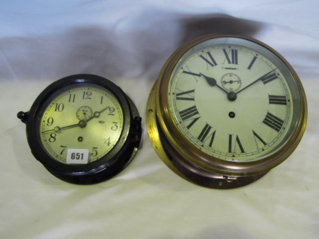 Appraisal: A brass cased marine clock with circular case single train