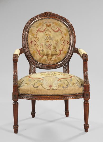 Appraisal: Louis XVI-Style Fruitwood Fauteuil early th century the padded medallion