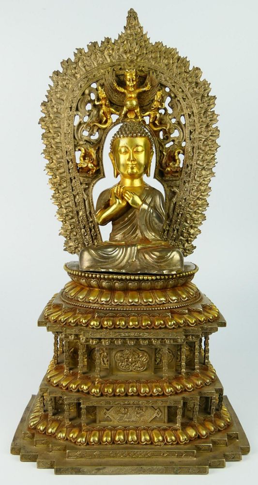 Appraisal: TIBETAN GILT SILVERED BRONZE BUDDHA ON THRONE Large Tibetan or