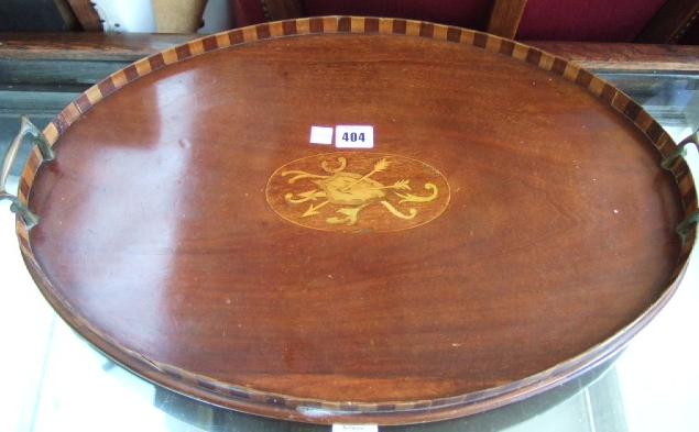 Appraisal: An Edwardian inlaid mahogany serving tray centred by shield and