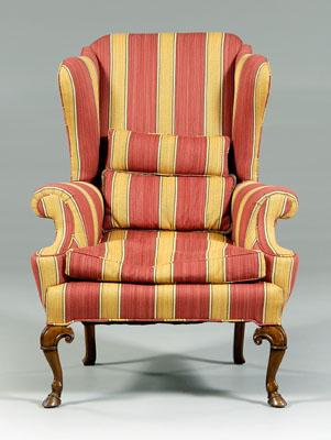 Appraisal: Georgian style upholstered wing chair finely carved walnut cabriole legs