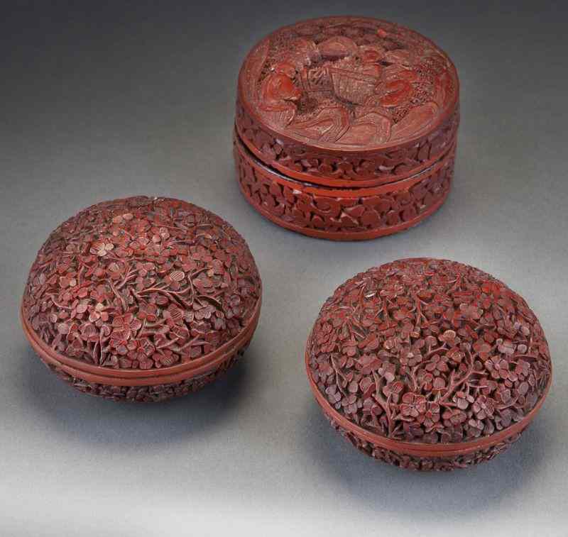 Appraisal: Chinese Qing carved cinnabar ink pads depicting plum blossoms and