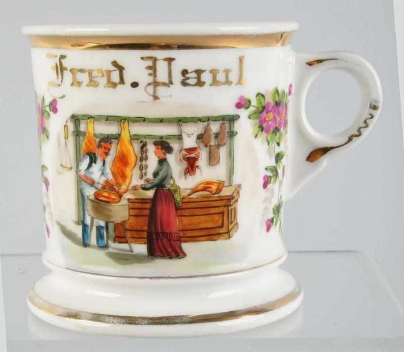 Appraisal: Butcher Shop Scene Shaving Mug Description Gilt name Fred Paul