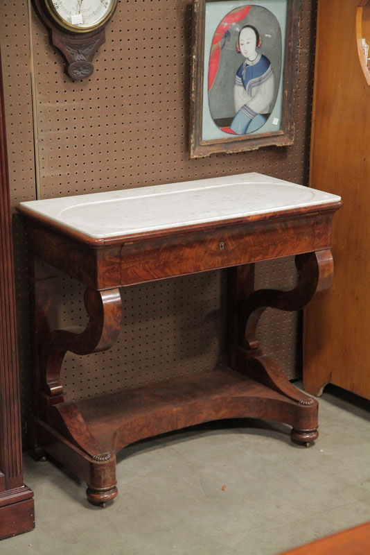 Appraisal: VICTORIAN DRESSING TABLE White marble top on a conforming mahogany