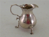 Appraisal: A George II Provincial silver cream jug by Isaac Cookson