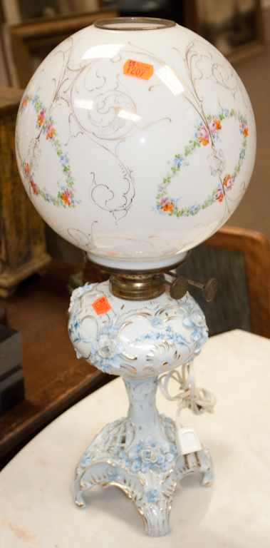 Appraisal: Sitzendorf porcelain oil lamp and a painted milk glass globe