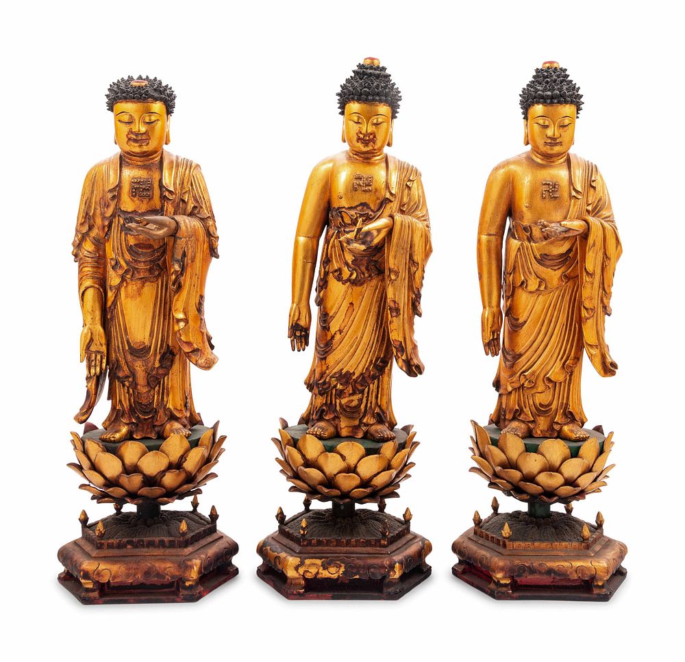 Appraisal: Three Gilt Lacquered Wood Figures of Buddha Three Gilt Lacquered