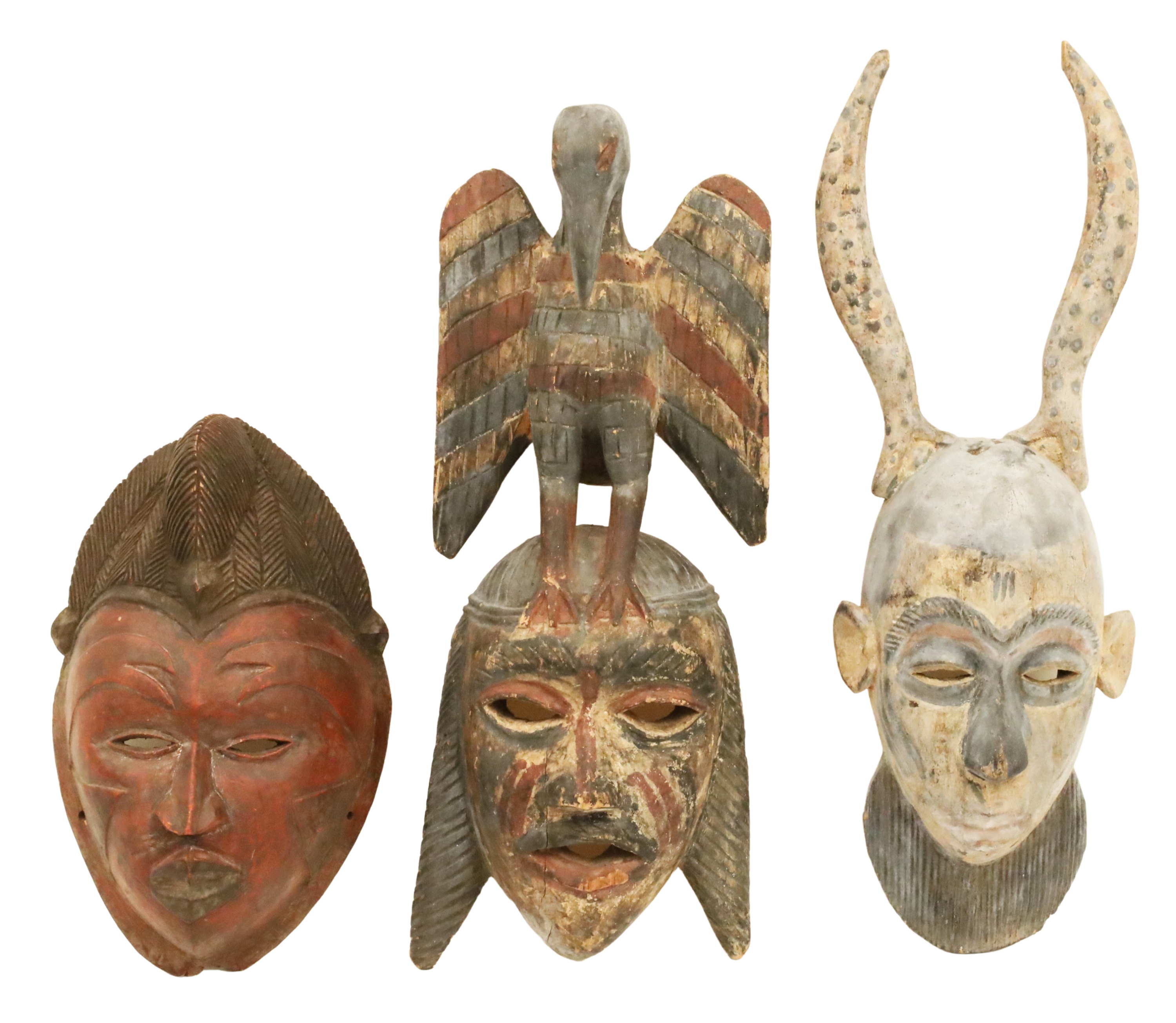 Appraisal: GROUP OF CARVED WOOD AND POLYCHROME CEREMONIAL MASKS Group of