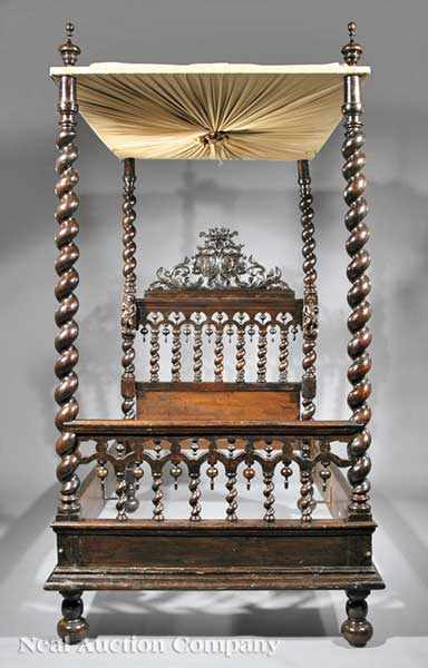 Appraisal: An Antique Portuguese Carved Walnut Four Poster Bed early th