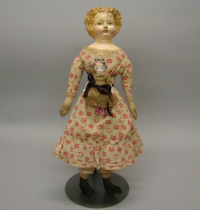 Appraisal: Pair of dolls Unmarked Sonneberg-type papier mache doll with molded