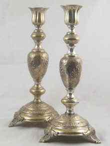 Appraisal: A pair of silver plated Shabat candlesticks on three feet