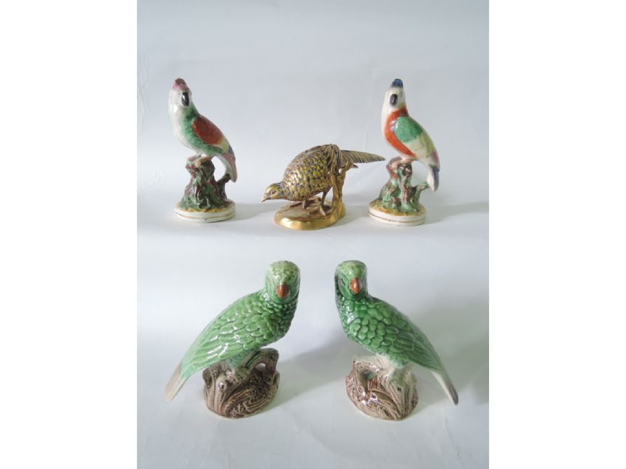 Appraisal: A pair of th century Staffordshire models of parrots with