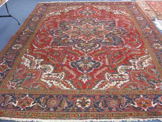 Appraisal: Heriz Persian Handmade Room Size Rug grand central medallion stylized