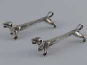 Appraisal: A pair of cast silver dachshund dog knife rests William