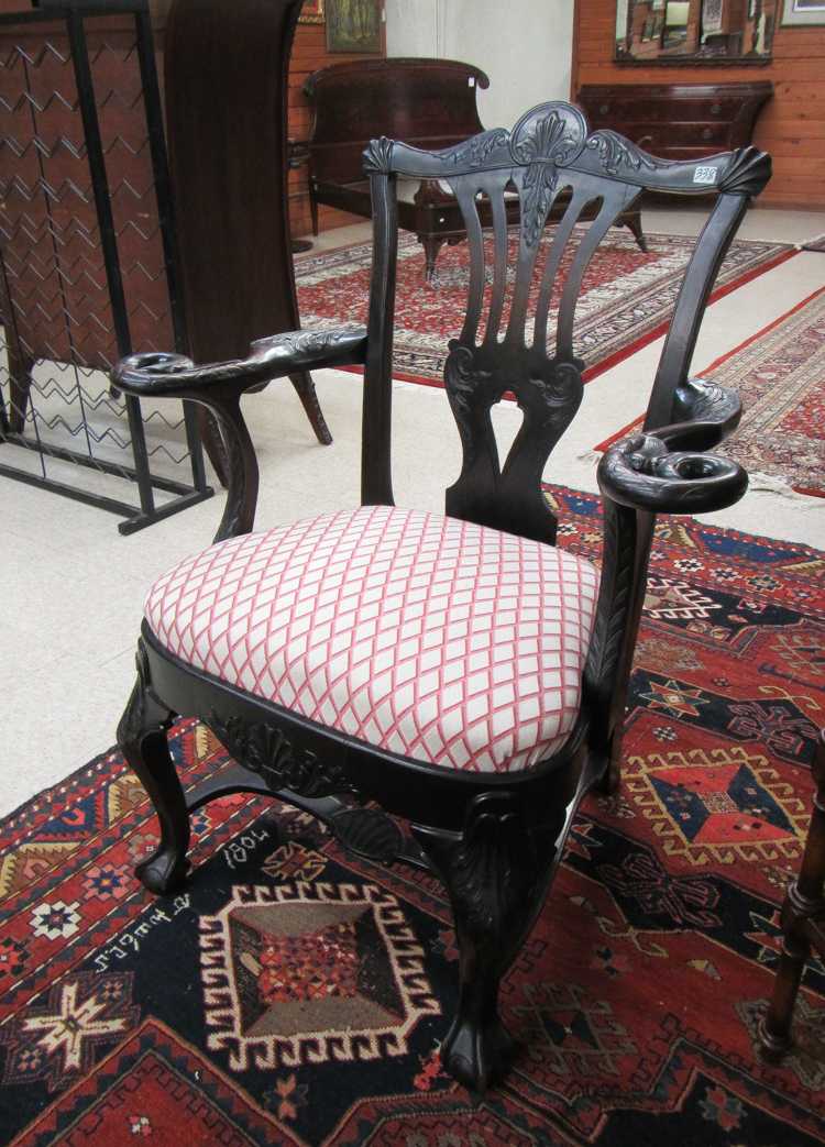 Appraisal: CENTENNIAL CHIPPENDALE MAHOGANY ARMCHAIR American th century featuring a central