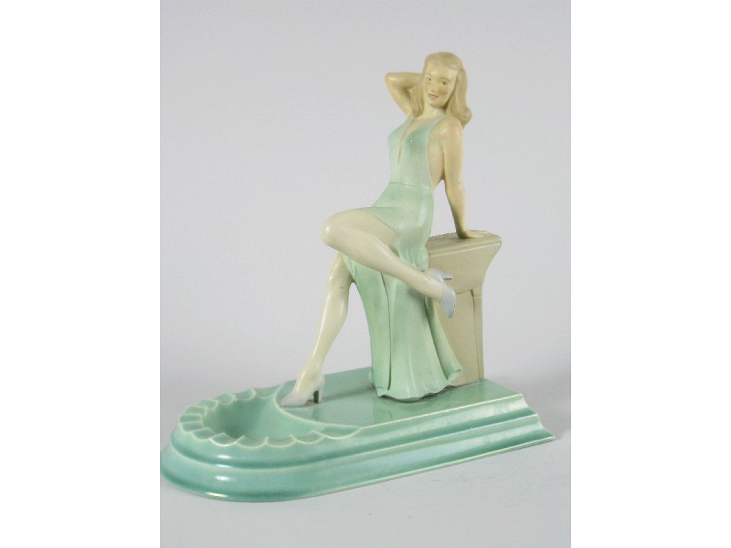 Appraisal: An Art Deco Branksome pottery Figure of girl reclining against